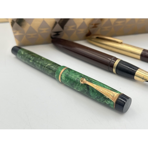 2302 - Four writing instruments, one Sheaffer fountain pen with 14ct gold nib, one Sheaffer propelling penc... 