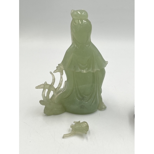 2308 - A hand carved jade Buddha figurine on hardwood stand - approx. 11cm high