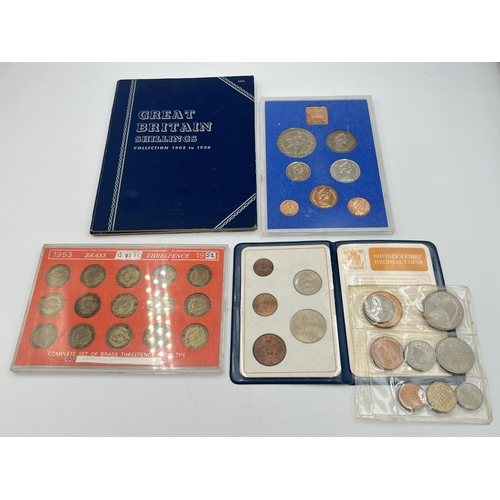 2323 - Four coin sets to include 'Britain's First Decimal Coins', Royal Mint 1977 etc. together with empty ... 