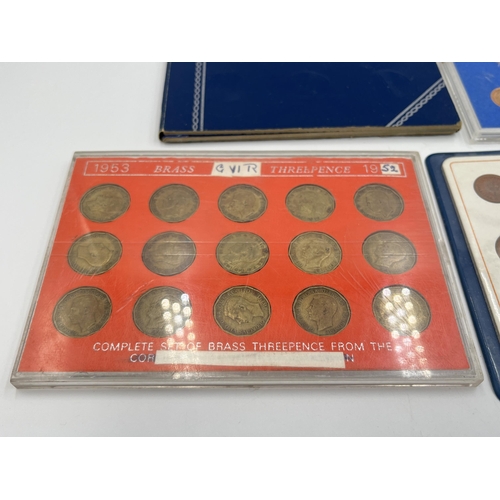 2323 - Four coin sets to include 'Britain's First Decimal Coins', Royal Mint 1977 etc. together with empty ... 