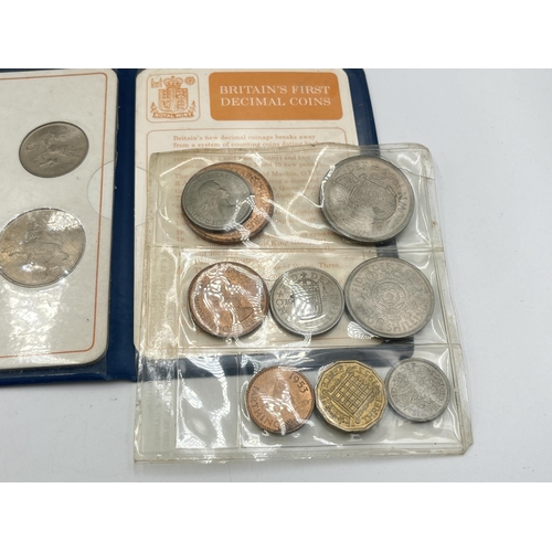 2323 - Four coin sets to include 'Britain's First Decimal Coins', Royal Mint 1977 etc. together with empty ... 