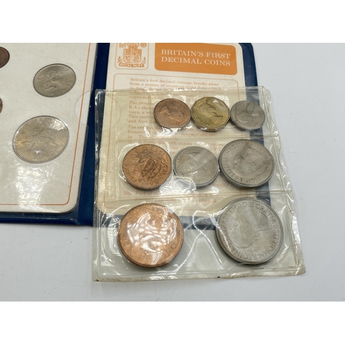 2323 - Four coin sets to include 'Britain's First Decimal Coins', Royal Mint 1977 etc. together with empty ... 