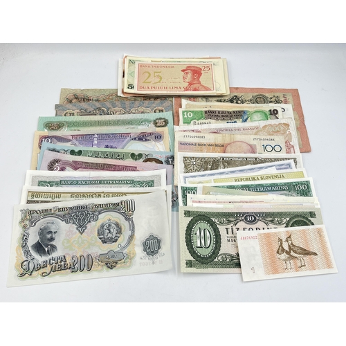 2328 - A collection of world banknotes to include Central Bank of Kenya, four Singapore $1, early 20th cent... 