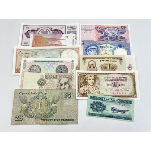 2328 - A collection of world banknotes to include Central Bank of Kenya, four Singapore $1, early 20th cent... 