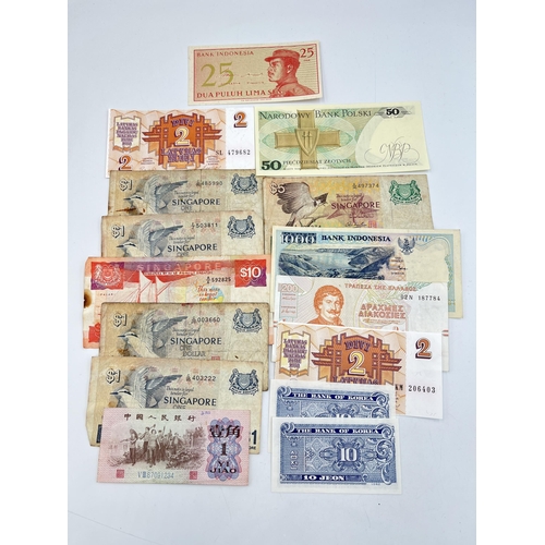 2328 - A collection of world banknotes to include Central Bank of Kenya, four Singapore $1, early 20th cent... 