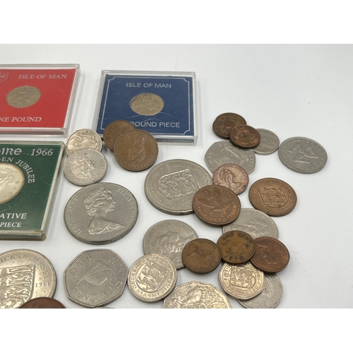 2329 - A collection of coins to include cased Sterling silver proof 1980 Isle of Man Christmas 50p, cased 1... 