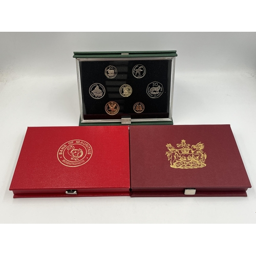 2344 - Three boxed and cased Royal Mint proof sets, one 1988 Hong Kong seven coin, one 1987 Falkland Island... 