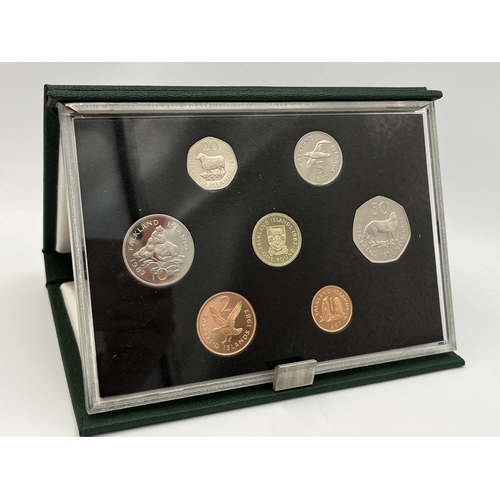 2344 - Three boxed and cased Royal Mint proof sets, one 1988 Hong Kong seven coin, one 1987 Falkland Island... 