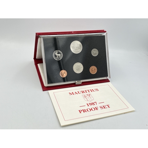 2344 - Three boxed and cased Royal Mint proof sets, one 1988 Hong Kong seven coin, one 1987 Falkland Island... 