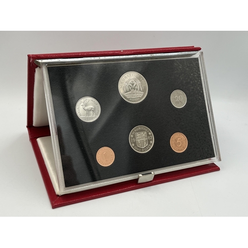 2344 - Three boxed and cased Royal Mint proof sets, one 1988 Hong Kong seven coin, one 1987 Falkland Island... 