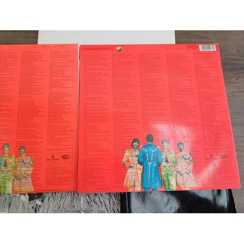 750 - Seven The Beatles LP vinyl records, two 'Sgt. Pepper's Lonely Hearts Club Band', 'The Beatles' (with... 