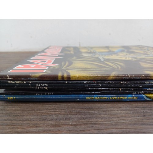 758 - Six Iron Maiden LP vinyl records to include three 'The Number of the Beast' (two are fame and one is... 