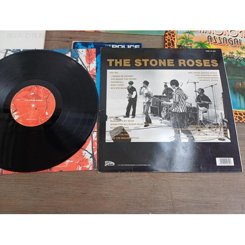 774 - Four boxes containing a very large collection of vinyl records to include The Stone Roses 'The Stone... 