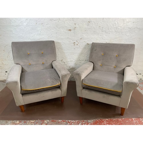 233A - A pair of mid 20th century grey and mustard yellow button back velvet upholstered armchairs - approx... 