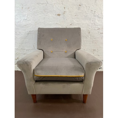 233A - A pair of mid 20th century grey and mustard yellow button back velvet upholstered armchairs - approx... 