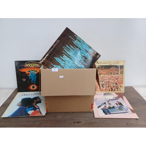 787 - A collection of vinyl records to include Tom Waits, The Walker Brothers, Murray Head, Boston, Ace, D... 