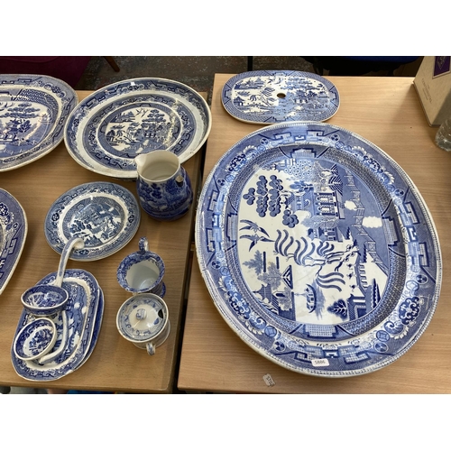 391 - A collection of 19th century and later Willow Pattern china to include WE stoneware meat plate, Maso... 