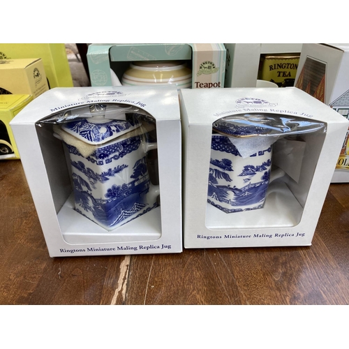 393 - A collection of Ringtons china to include two boxed miniature Maling replica jugs, boxed Willow patt... 