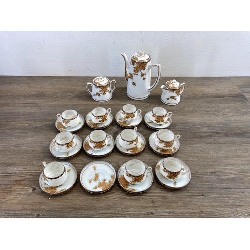 402 - A Japanese hand painted egg shell porcelain twenty six piece coffee set