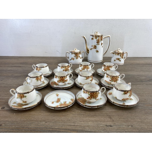 402 - A Japanese hand painted egg shell porcelain twenty six piece coffee set