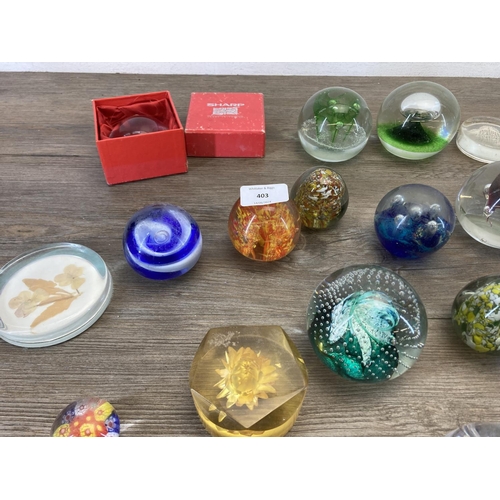 403 - A collection of art glass and Lucite paperweights to include Caithness, Mdina seahorse etc.