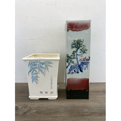 409 - Two pieces of Oriental ceramics, one planter and one stick stand - approx. 46cm high