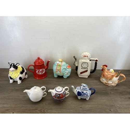 421 - Eight ceramic teapots and storage jars to include Past Times Elephant, Nestle KitKat, South-West Cer... 