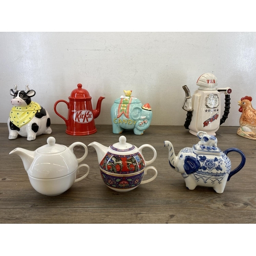 421 - Eight ceramic teapots and storage jars to include Past Times Elephant, Nestle KitKat, South-West Cer... 