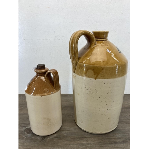 422 - Two early/mid 20th century stoneware flagons - largest approx. 41cm high