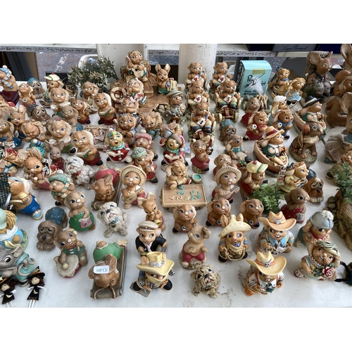 431 - An extensive collection of Pendelfin rabbit figurines and display stands to include Betsy Barge, Fat... 