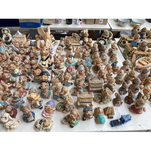 431 - An extensive collection of Pendelfin rabbit figurines and display stands to include Betsy Barge, Fat... 