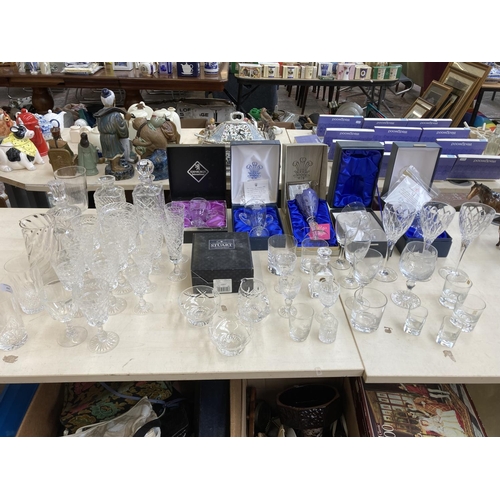 434 - A collection of glassware to include Stuart Crystal, Edinburgh Crystal, Thomas Webb, RCR etc.