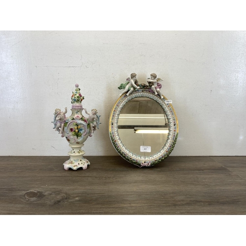 437 - Two pieces of Continental hand painted porcelain, one oval wall mirror - approx. 35cm high x 26cm wi... 