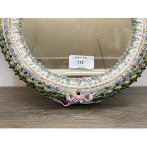 437 - Two pieces of Continental hand painted porcelain, one oval wall mirror - approx. 35cm high x 26cm wi... 