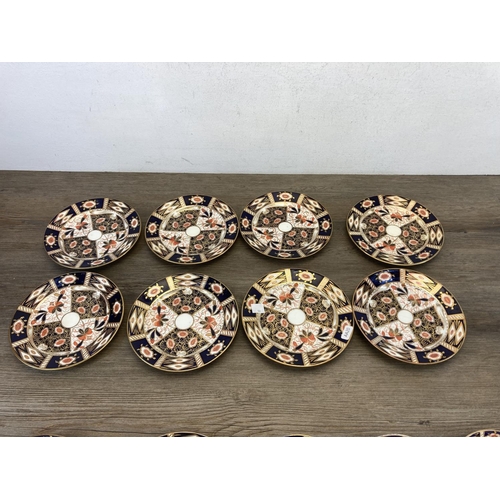 443 - Fourteen Imari pattern plates and saucers to include three Royal Crown Derby etc.