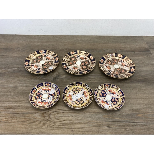 443 - Fourteen Imari pattern plates and saucers to include three Royal Crown Derby etc.