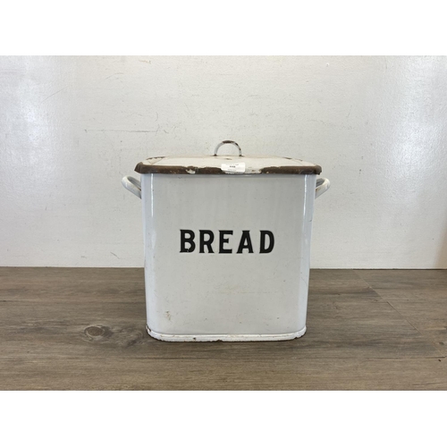 448 - A mid 20th century white enamel twin handled lidded bread bin - approx. 31cm high x 39cm wide x 25cm... 