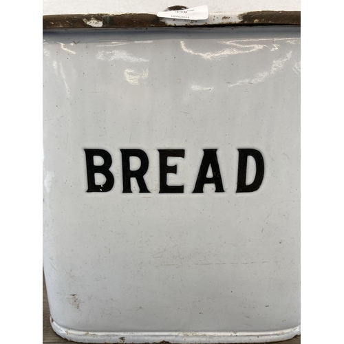 448 - A mid 20th century white enamel twin handled lidded bread bin - approx. 31cm high x 39cm wide x 25cm... 