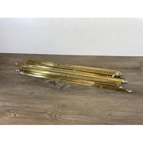 449 - Twelve late 19th century brass stair rods - each approx. 75cm long