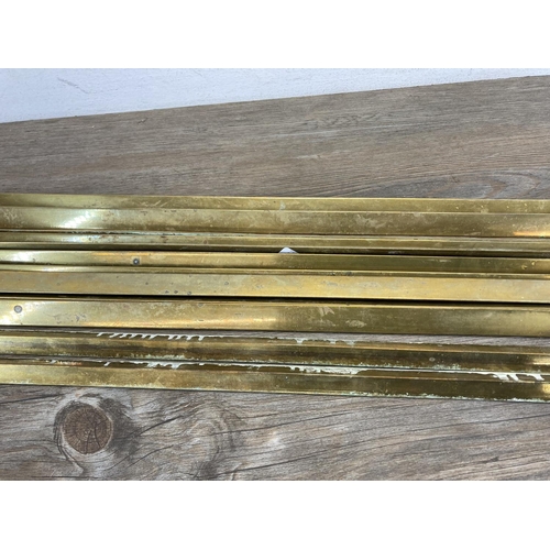 449 - Twelve late 19th century brass stair rods - each approx. 75cm long