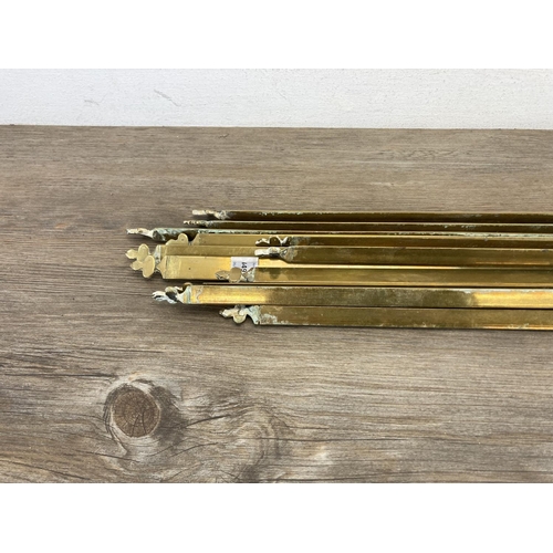 449 - Twelve late 19th century brass stair rods - each approx. 75cm long