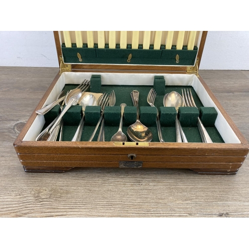 460 - A 1930s/1940s walnut presentation canteen of cutlery, presented by The United Africa Company Limited... 