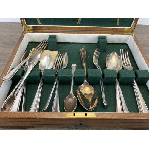 460 - A 1930s/1940s walnut presentation canteen of cutlery, presented by The United Africa Company Limited... 