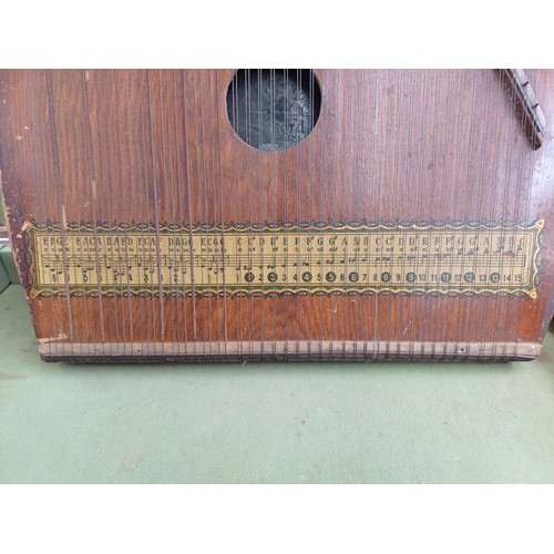 839 - A cased Piano-Chord six-chord zither with tuning key