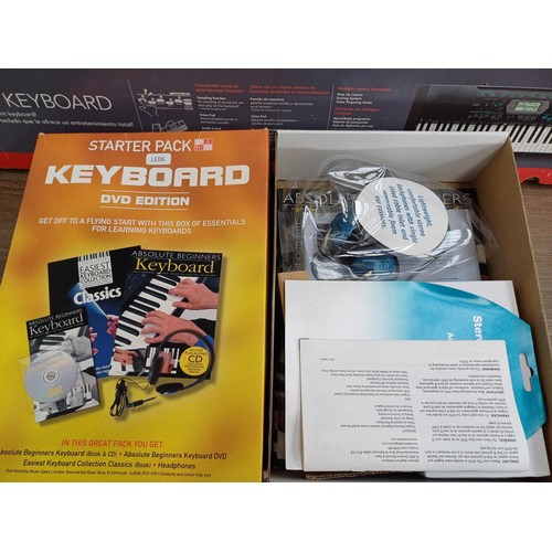 842 - A boxed Casio CTK-2100 electronic keyboard with power adapter, instruction manual, song book, boxed ... 