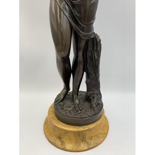 2300 - A patinated bronze sculpture after Jean-Antoine Houdon (1741-1828) on yellow marble finish plinth, t... 