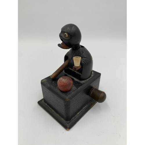 2313 - An early 20th century Japanese Kobe carved and ebonised wooden automaton toy - approx. 9cm high