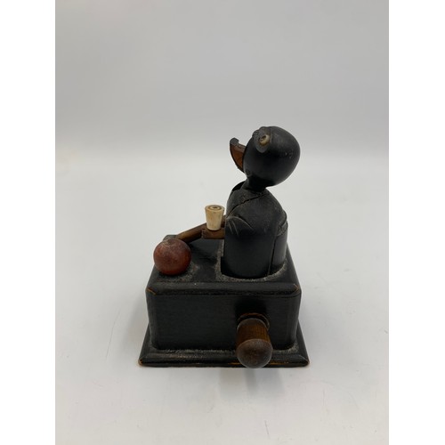 2313 - An early 20th century Japanese Kobe carved and ebonised wooden automaton toy - approx. 9cm high