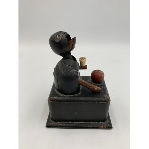 2313 - An early 20th century Japanese Kobe carved and ebonised wooden automaton toy - approx. 9cm high