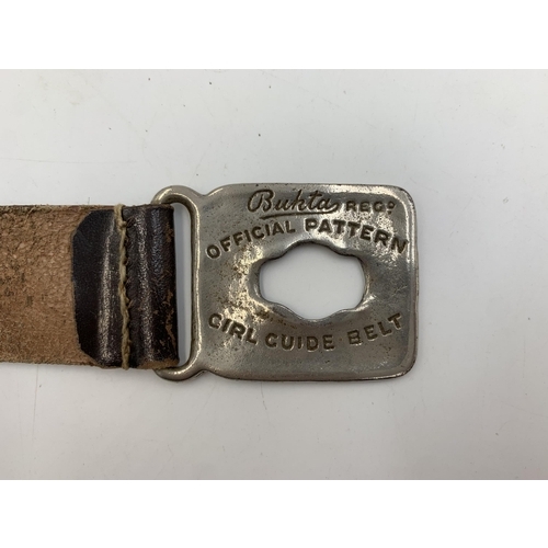 2310 - A vintage Girl Guides Association leather belt with attached The Acme City Whistle and Taylor Sheffi... 